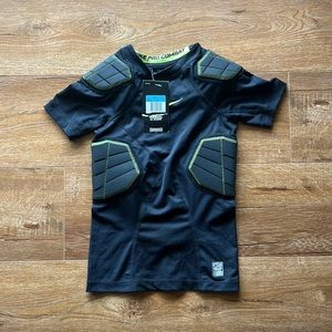 NWT Boys Nike compression shirt with pads.  Size Med.